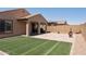 Artificial turf, fire pit, and covered patio at 20138 W Madison St, Buckeye, AZ 85326