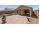 Backyard with patio, artificial turf, and fire pit at 20138 W Madison St, Buckeye, AZ 85326