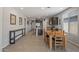 Open concept dining area with wooden table and view into the kitchen at 20138 W Madison St, Buckeye, AZ 85326