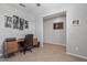 Bright home office with wood desk and large wall art at 20138 W Madison St, Buckeye, AZ 85326