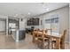 Eat-in kitchen with wood dining table and modern appliances at 20138 W Madison St, Buckeye, AZ 85326