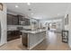 Modern kitchen with granite island and dark wood cabinets at 20138 W Madison St, Buckeye, AZ 85326