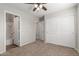 Bedroom with private bath and double doors to closet at 2028 N 77Th Ln, Phoenix, AZ 85035