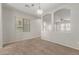 Dining area with arched openings and a chandelier at 2028 N 77Th Ln, Phoenix, AZ 85035