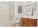 Bathroom with tub, shower, and wood vanity at 20475 N Herbert Ave, Maricopa, AZ 85138