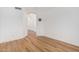 Bright hallway with hardwood floors and access to other rooms at 20475 N Herbert Ave, Maricopa, AZ 85138