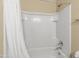 Clean bathroom with shower/tub combo and white tile at 2150 W Alameda Rd # 1251, Phoenix, AZ 85085