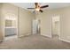 Spacious bedroom with ceiling fan and ensuite bathroom access at 2150 W Alameda Rd # 1251, Phoenix, AZ 85085