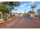 Gated community entrance with brick pavers and landscaping at 2150 W Alameda Rd # 1251, Phoenix, AZ 85085