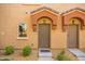 Townhome entry with double doors and desert landscaping at 2150 W Alameda Rd # 1251, Phoenix, AZ 85085