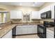 Modern kitchen with granite countertops and black appliances at 2150 W Alameda Rd # 1251, Phoenix, AZ 85085