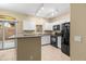 Modern kitchen with granite countertops and black appliances at 2150 W Alameda Rd # 1251, Phoenix, AZ 85085