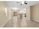 Living room with tile floors, kitchen access, and ceiling fan at 2150 W Alameda Rd # 1251, Phoenix, AZ 85085