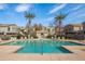 Community pool with lounge chairs and shade structures at 2150 W Alameda Rd # 1251, Phoenix, AZ 85085