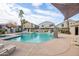 Community pool area with multiple lounge chairs and shade structures at 2150 W Alameda Rd # 1251, Phoenix, AZ 85085