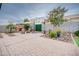 Landscaped backyard with patio, fire pit, and seating area at 21556 S 215Th Pl, Queen Creek, AZ 85142