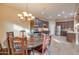 Bright dining area with round table and wooden chairs at 21556 S 215Th Pl, Queen Creek, AZ 85142