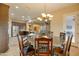 Kitchen and dining area with a round table and chairs at 21556 S 215Th Pl, Queen Creek, AZ 85142