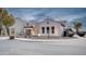 House with three-car garage and desert landscaping at 21556 S 215Th Pl, Queen Creek, AZ 85142