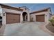 Home with two-car garage and welcoming entryway at 21556 S 215Th Pl, Queen Creek, AZ 85142