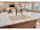 Kitchen island with granite countertop and modern sink at 21556 S 215Th Pl, Queen Creek, AZ 85142