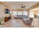 Living area with sectional sofa and views into kitchen and dining area at 21556 S 215Th Pl, Queen Creek, AZ 85142