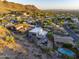 Aerial view showing house and pool with mountain backdrop at 2208 E Belmont Ave, Phoenix, AZ 85020