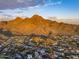 Wide aerial view of neighborhood and mountain range at 2208 E Belmont Ave, Phoenix, AZ 85020