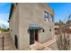 Side view of a modern home with a metal awning and sliding glass doors at 2208 E Belmont Ave, Phoenix, AZ 85020