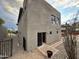 Rear view of contemporary home with sliding glass doors and a stone pathway at 2208 E Belmont Ave, Phoenix, AZ 85020