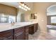 Primary bathroom with dual sinks, a soaking tub, and shower at 24710 N 27Th Pl, Phoenix, AZ 85024