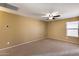 Bright bedroom with ceiling fan and neutral wall tones at 24710 N 27Th Pl, Phoenix, AZ 85024