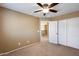 Spacious bedroom with ceiling fan and ample closet space at 24710 N 27Th Pl, Phoenix, AZ 85024