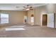 Bright bedroom featuring a ceiling fan and ensuite bathroom access at 24710 N 27Th Pl, Phoenix, AZ 85024