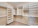 Large walk-in closet with ample shelving and hanging space at 24710 N 27Th Pl, Phoenix, AZ 85024