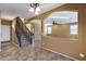 Entryway with tile flooring, staircase, and arched openings leading to living areas at 24710 N 27Th Pl, Phoenix, AZ 85024