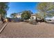 Side view of the house showing additional landscaping at 24710 N 27Th Pl, Phoenix, AZ 85024