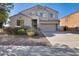 Two-story house with a large driveway and landscaping at 24710 N 27Th Pl, Phoenix, AZ 85024