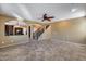 Open living room with a view of kitchen and staircase at 24710 N 27Th Pl, Phoenix, AZ 85024