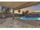 Sunset view from covered patio overlooking pool and spa at 24710 N 27Th Pl, Phoenix, AZ 85024