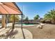 Inviting kidney-shaped pool with a spa and a relaxing patio area at 24710 N 27Th Pl, Phoenix, AZ 85024