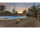 Freeform swimming pool with a rock waterfall feature in the backyard at 24710 N 27Th Pl, Phoenix, AZ 85024