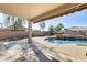 Covered patio overlooking a sparkling pool and spa at 24710 N 27Th Pl, Phoenix, AZ 85024