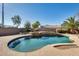 Relaxing kidney-shaped pool, spa, and surrounding patio at 24710 N 27Th Pl, Phoenix, AZ 85024