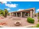 Backyard patio with brick pavers and a fire pit area at 25037 S Ribbonwood Dr, Sun Lakes, AZ 85248