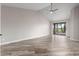 Bright bedroom with sliding doors to patio and ceiling fan at 25037 S Ribbonwood Dr, Sun Lakes, AZ 85248