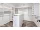 Large walk-in closet with ample shelving and hanging space at 25037 S Ribbonwood Dr, Sun Lakes, AZ 85248