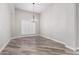 Formal dining area with window and wood-look floors at 25037 S Ribbonwood Dr, Sun Lakes, AZ 85248