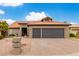 House exterior featuring a two-car garage at 25037 S Ribbonwood Dr, Sun Lakes, AZ 85248