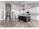 Modern kitchen with a large island and white cabinets at 25037 S Ribbonwood Dr, Sun Lakes, AZ 85248